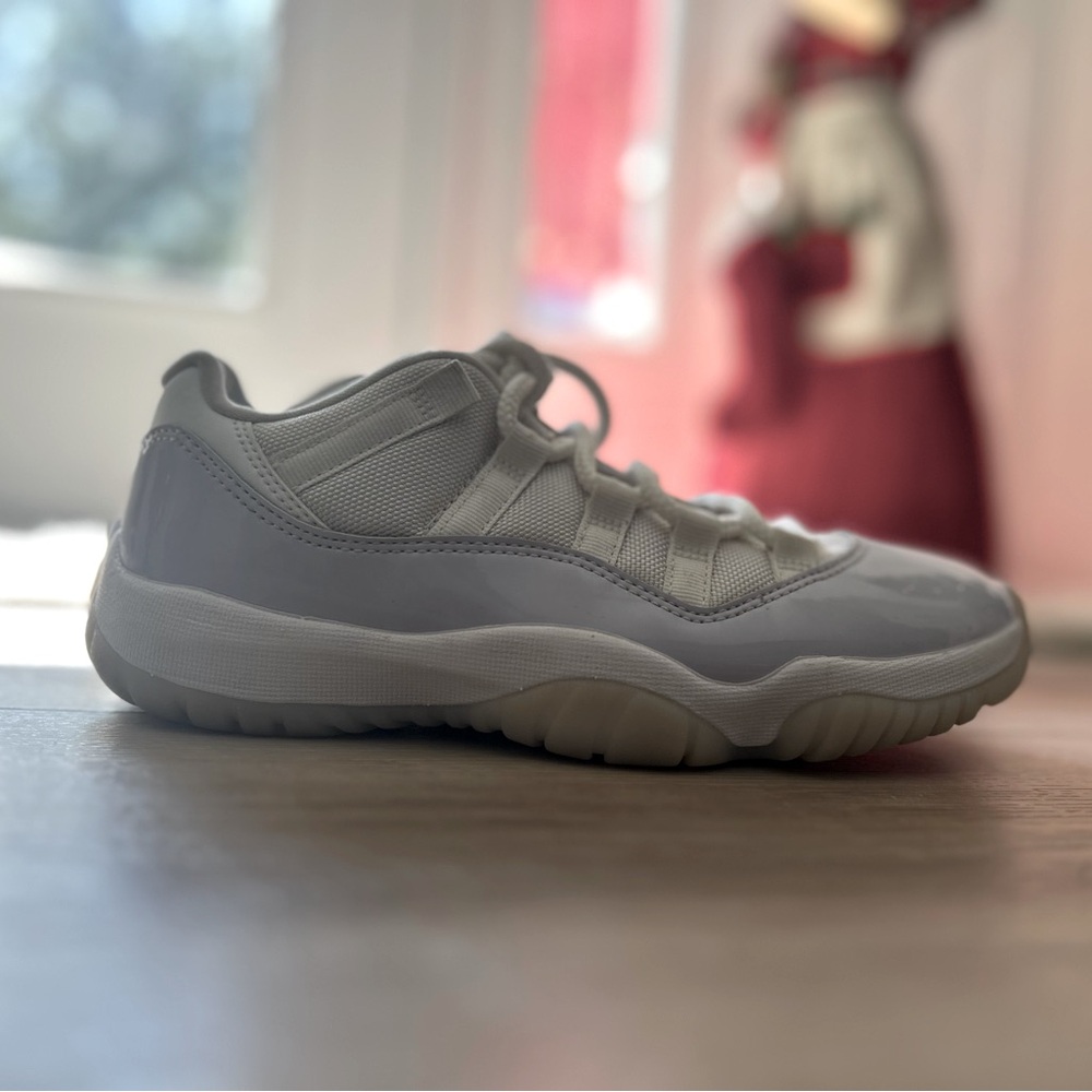 Jordan 11 lows in an all white color way size 7